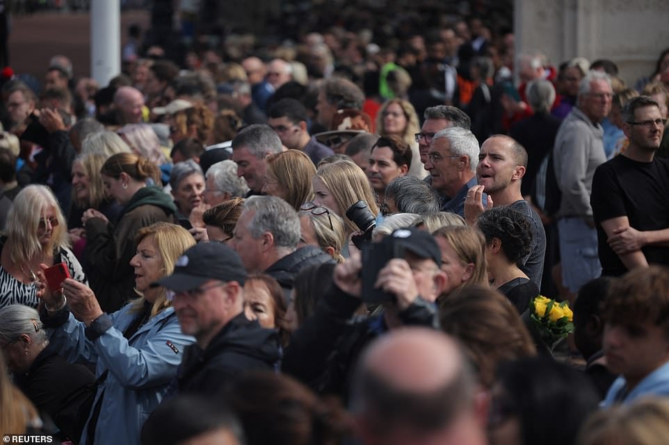 People gather on the day the coffin is transported from Buckingham Palace to the Houses of Parliament