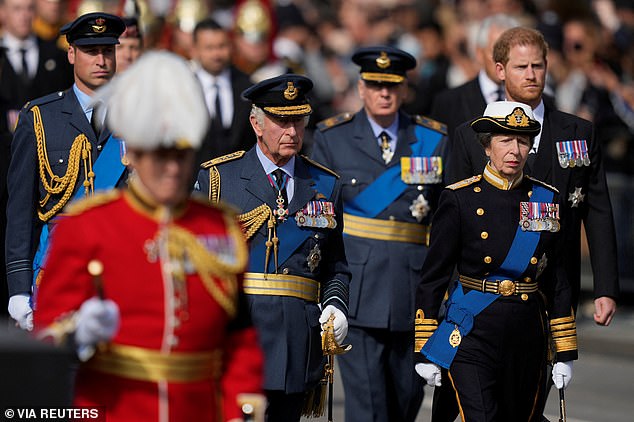 King Charles III, Princess Anne, Prince Harry, and Prince William, follow the coffin of Queen Elizabeth II during a procession from Buckingham Palace to Westminster Hall