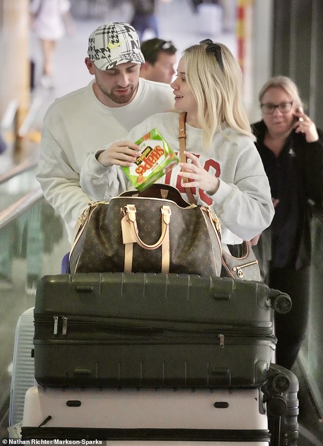 After collecting their luggage and a packet of Shapes, the pair made their way to the car park