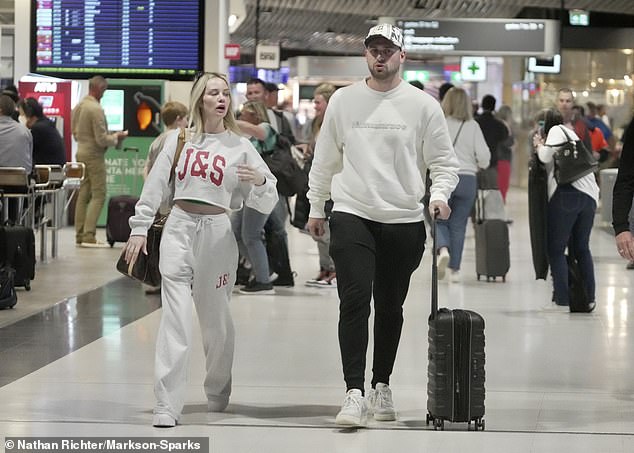 Connor, who has been dating Jess for more than a year, dressed casually in an off-white jumper, black skinny jeans, sneakers and a patterned cap