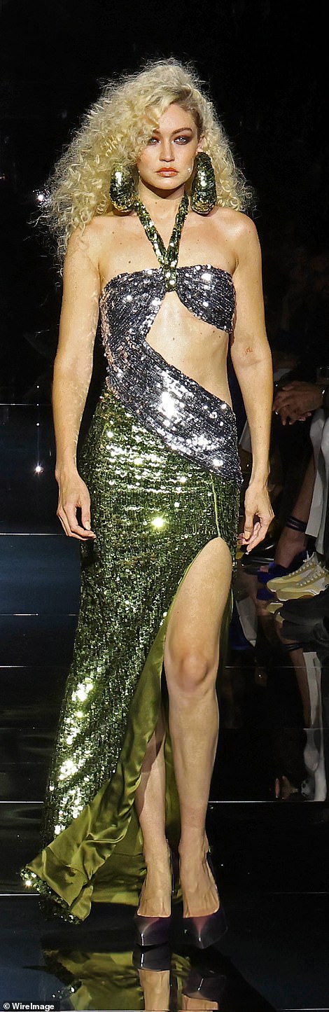 Classic: She channeled disco chic with a silver-and-gold sequin-covered dress with separate gold halter straps