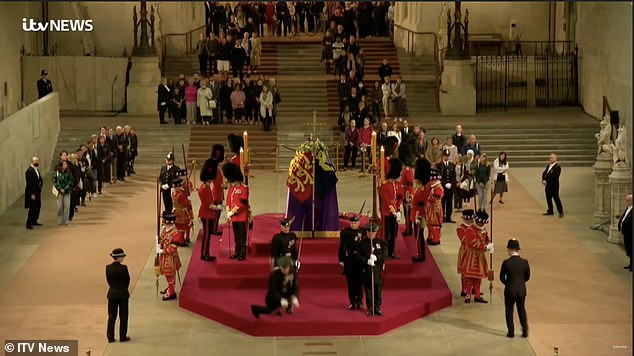 Members of the public inside the historic hall to pay their final respects gave out loud grasps as the man fell