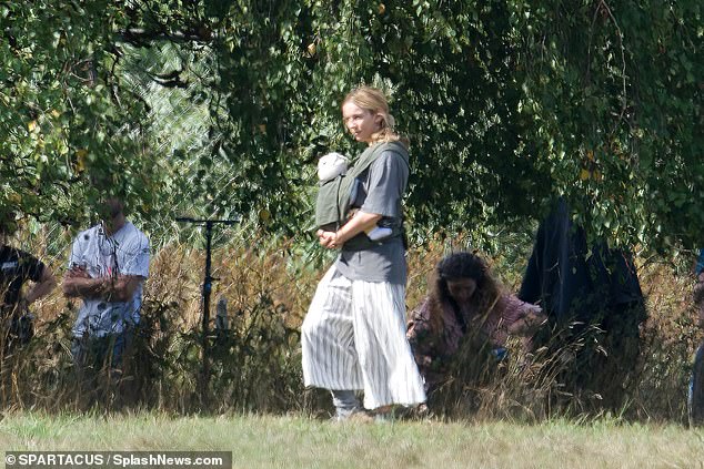 Low-key: She dressed down for the part in a large grey t-shirt and a striped maxi skirt