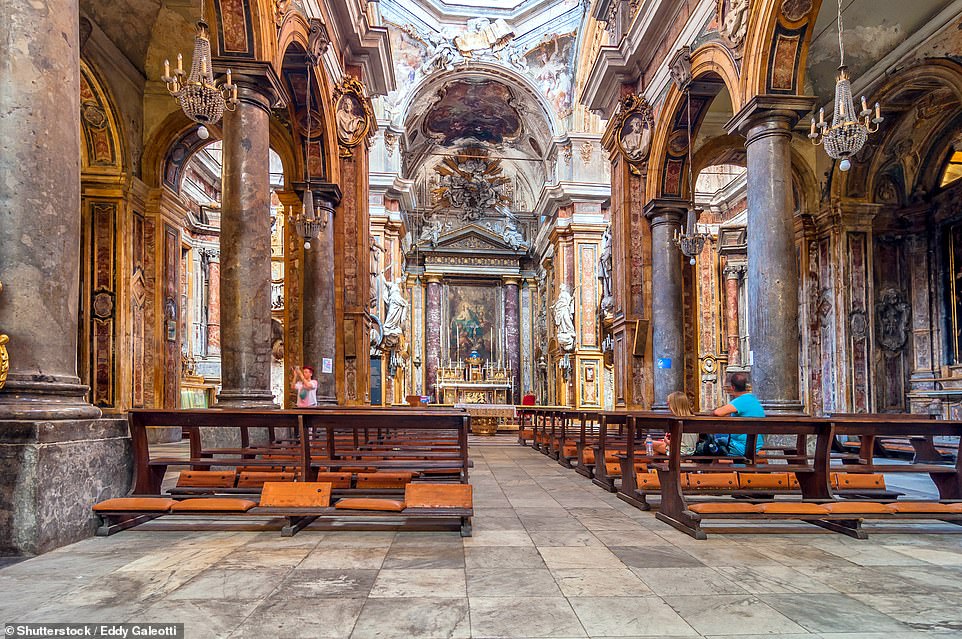 Nigel climbs the roughly 140 steps to the cupola of the Santissimo Salvatore church (pictured), which 'at times is like ascending a corkscrew'