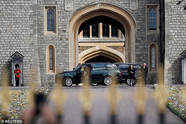 Prince Andrew, Duke of York and Sarah, Duchess of York look at floral tributes laid by people near Windsor Castle, following the death of Britain's Queen Elizabeth