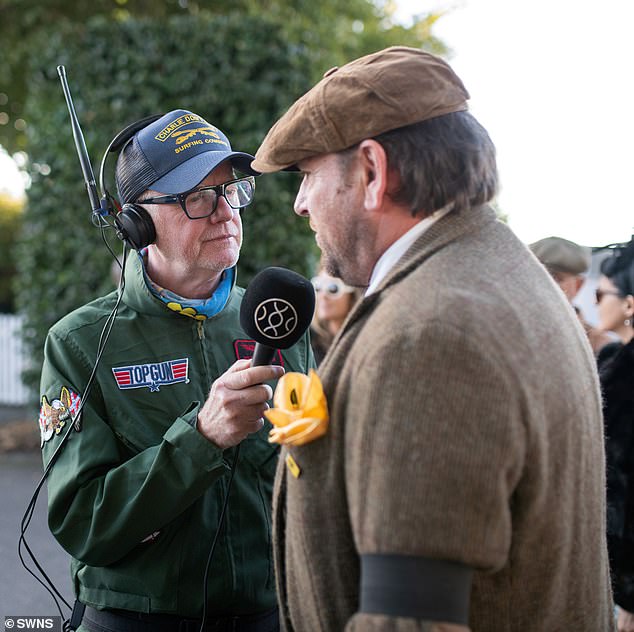 Face to face: Martin was interviewed by Evans as he made his way into the event on Friday