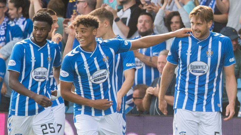 KILMARNOCK, SCOTLAND - AUGUST 27: Kilmarnocks&#39; Ash Taylor (R) celebrates making it 2-1 with his teammates during a cinch Premiership match between Kilmarnock and Motherwell at Rugby Park, on August 27, in Kilmarnock, Scotland.  (Photo by Craig Foy / SNS Group)