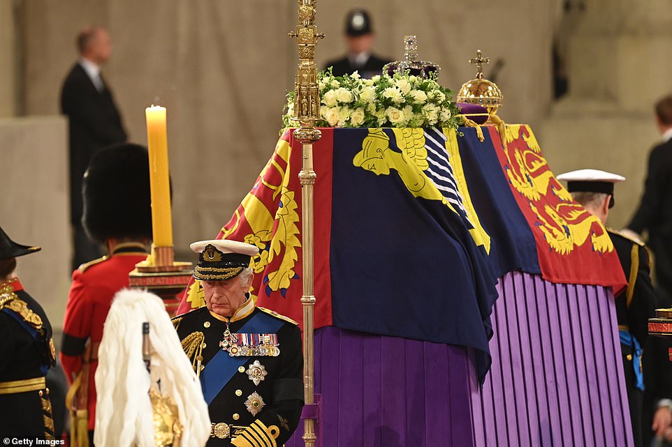 As tearful mourners watched on, the Queen's four children stood guard of their mother's coffin for more than 10 minutes at Westminster Hall this evening. The siblings each guarded a side of the coffin, with Charles, dressed in a Navy Admiral uniform, standing at the head