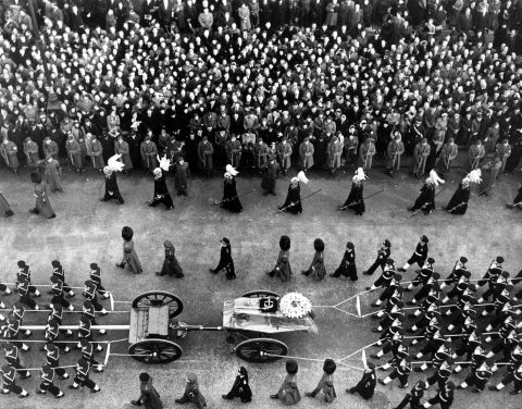 The King's coffin makes its way through the streets of London on its way to Paddington station.