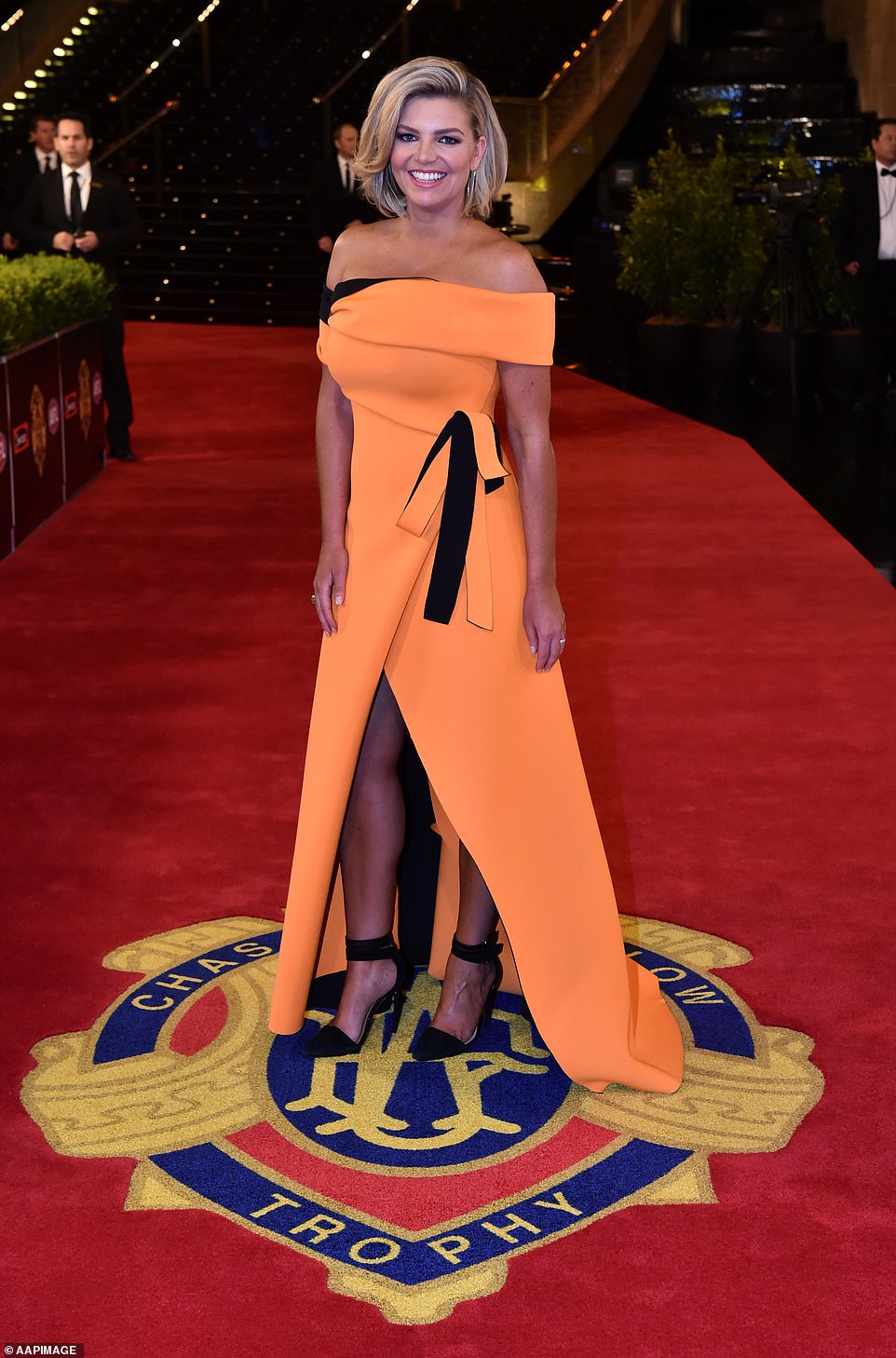 Rebecca Maddern sported a bright orange outfit by Sonia Cappallezazo at the Brownlow Medal Ceremony in 2015