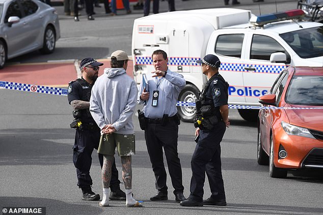 Thomas Friedrich Myler, 35, Stuart Galloway and Luke Thomas Moore, both 34, are the other three people who have been arrested over the attack (pictured, police at the scene on Monday)