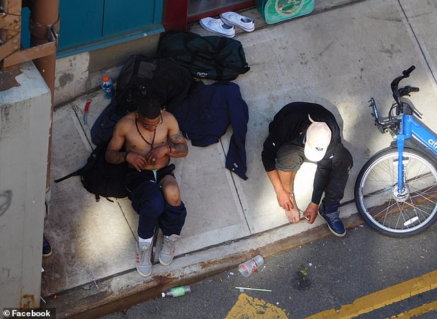 Two men were pictured on May 28 taking drugs out in the open in East Harlem's La Marqueta marketplace