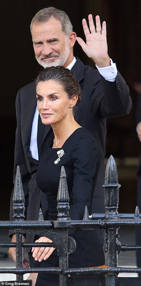 The Spanish king and his former journalist wife will be among the heads of state who will gather at Buckingham Palace tonight for Prince Charles's 'reception of the century'. Pictured, waving to well-wishers in London on Sunday