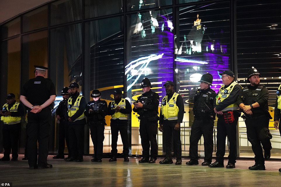 Near Tower Bridge in London, police officers stood together to observe the silence to reflect on the Queen's legacy