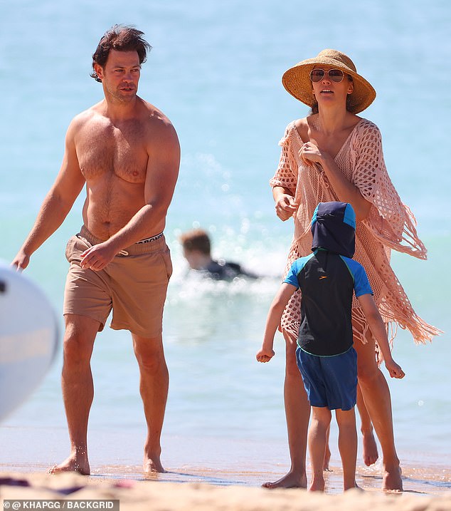 The former Miss Universe Australia was joined by her dancer husband Michael Miziner (left) and their two children, son Dominic, four, (centre) and daughter Violet, eight for the family outing