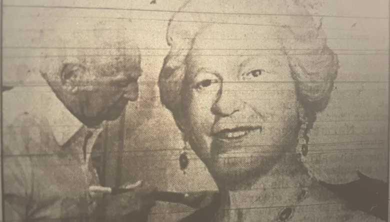 Sudbury artist Bruno Cavallo uses a paint brush on a large picture of Queen Elizabeth II. 