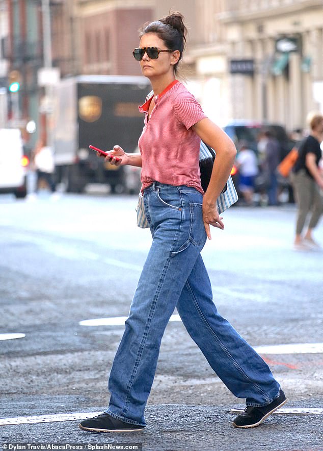 Phone: She was also carrying her red phone on her walk on Broadway, with her outing coming just a few weeks after wishing two members of her family a happy birthda