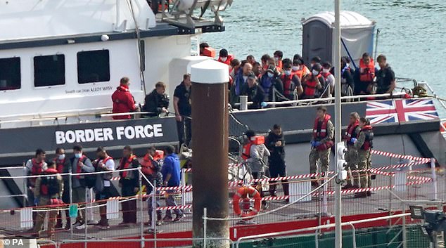 Migrants heading for Britain across the Channel are brought into Dover