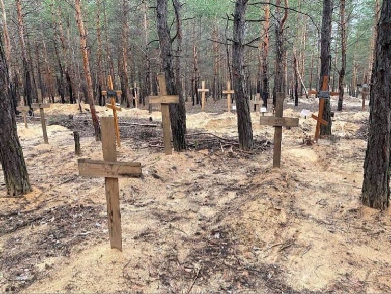 Izium: At least 440 graves found at burial site, Ukraine says