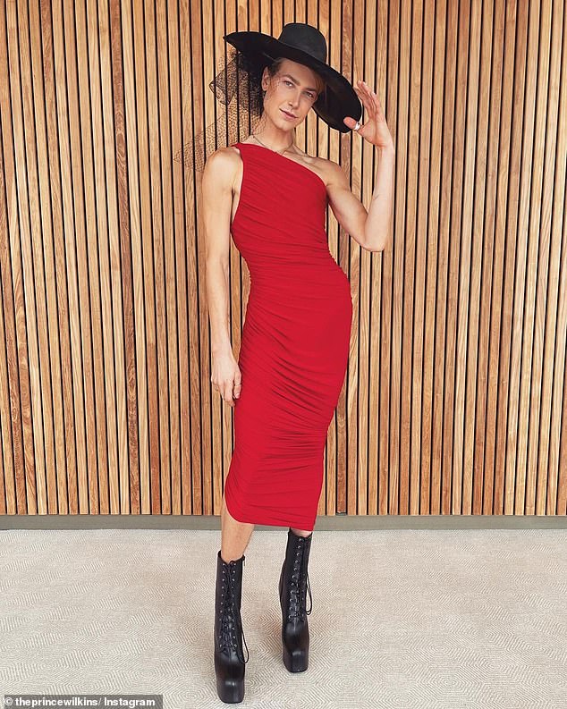 Christian Wilkins looks sensational in a figure-hugging red dress and platform boots