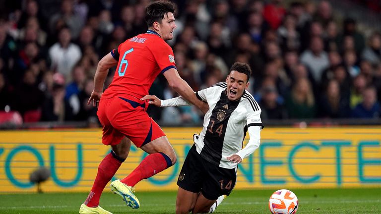 Harry Maguire fouls Jamal Musiala to concede a penalty after giving the ball away