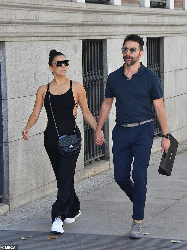 Eva Longoria wears a figure hugging bodysuit with her husband José Bastón in Madrid