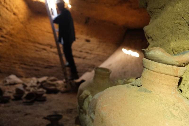 The cave was uncovered on a beach when a mechanical digger  hit its roof, with archaeologists using a ladder to descend into the