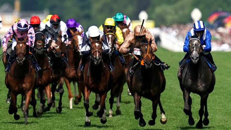 Heredia (gold cap) drifts across but holds on to win the Sandringham Stakes at Royal Ascot