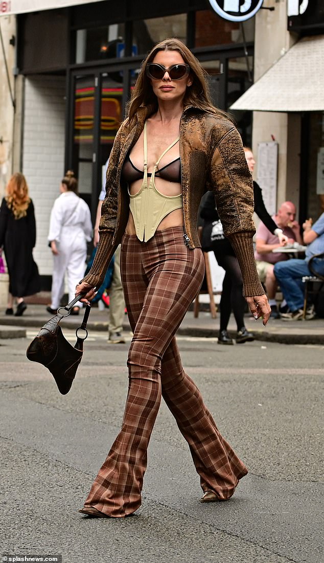 Julia Fox commands attention in a typically daring outfit as she dons a sheer bra in London