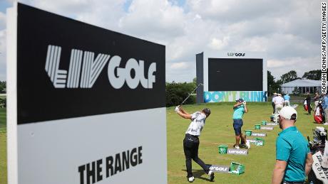 Players practice on the driving range ahead of the LIV Golf event in St. Albans, England, in June. 