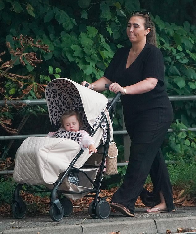 Lauren Goodger takes daughter Larose for a walk in her pram after the tragic death of newborn Lorena