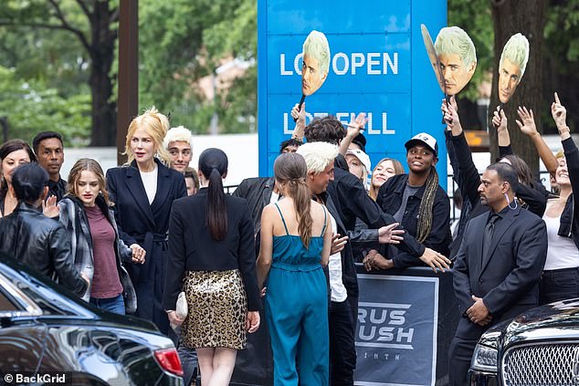 Nicole Kidman and Joey King holds hands while SURROUNDED by Zac Efron fans on The Family Affair set