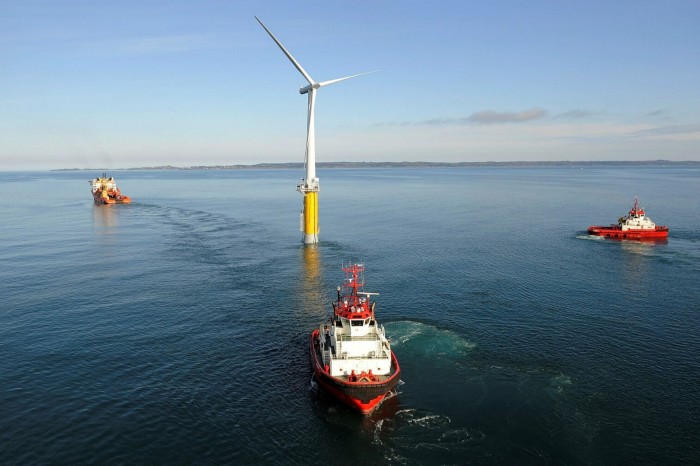 Hywind tow from Åmøyfjorden to Karmø. Floating windmill at sea in deep water 