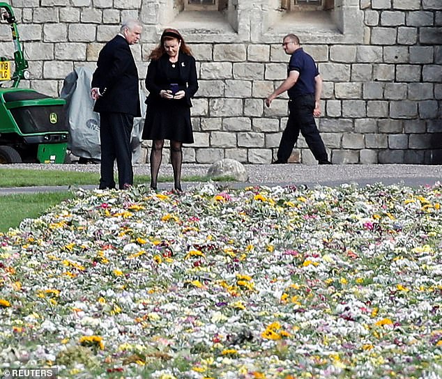 Sarah Ferguson joins Prince Andrew to look at floral tributes left outside Windsor Castle