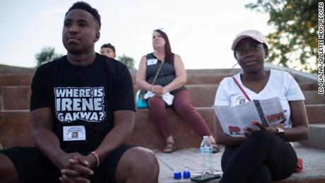 Chris Munga and his wife, Gyoice Abatey, attend a vigil for his missing sister  in Gillette, Wyoming. The couple makes the 12-hour drive from their home in Meridian, Idaho, to take part in local searches. 