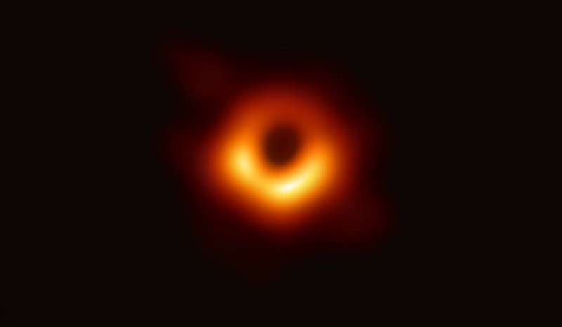 Astronomers deliver first photo of black hole