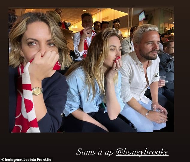 WAG Jesinta Franklin celebrates the Swans victory as she watches the game