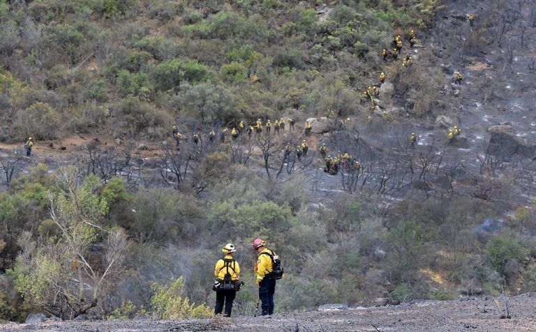 Massive California fire eases with rains