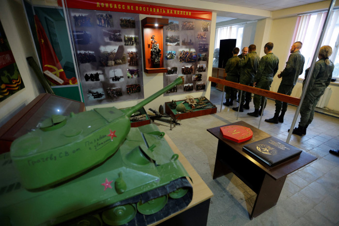 People line up to vote during a referendum at a military unit in Luhansk on Friday