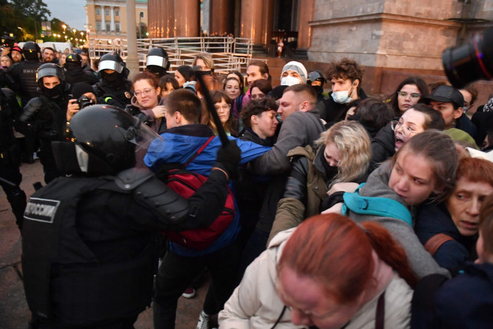 Police officers detain demonstrators in Saint Petersburg, Russia, on September 21 2022