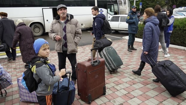 Russian officials, over 70,000 residents have left Kherson in recent days