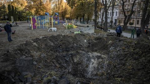 A crater left by a missile strike next to a children's playground in Kyiv on Monday.