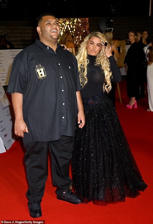 Proud: proud mum Katie walked with her son along the star studded red carpet