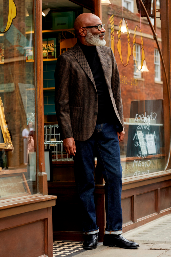 A bearded middle-aged man models a tweed blazer