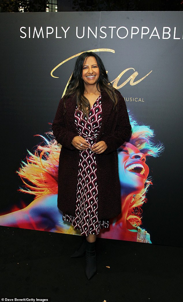 Chic: Ranvir, 37, put on an eye-popping display in a midi dress with red-and-and-black swirled prints as they embraced one another outside The Aldwych Theatre