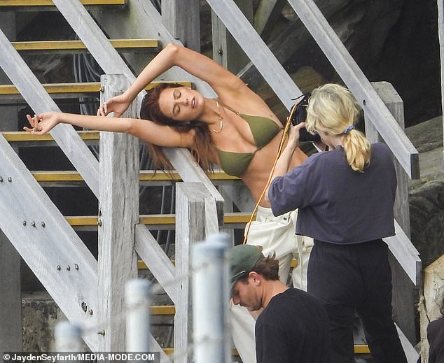 She made the photoshoot look effortless as she posed for the camera, draping herself over the hand railing of the stairs