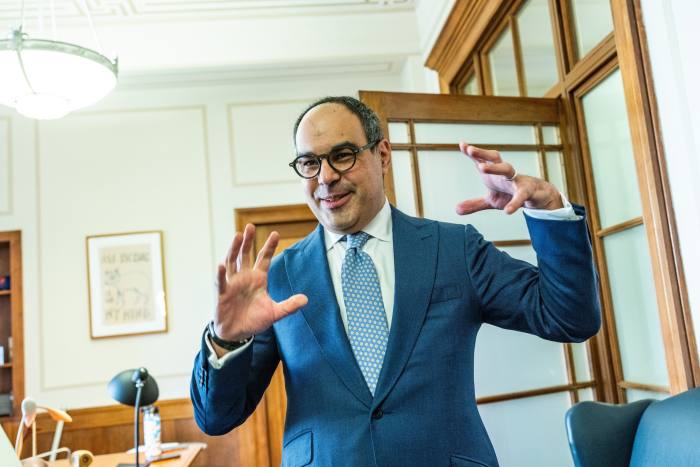 Jonathan Kanter gestures in his office