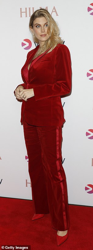 Stunning: The former reality star wowed in a glamorous red velvet blazer and coordinated flared trousers