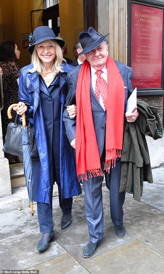 Two's company: Barry Humphries, 88, and his wife Lizzie were seen arm in arm at the service