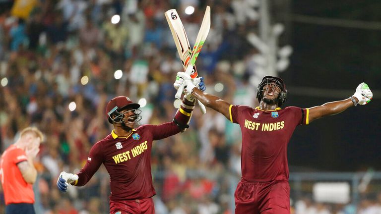 West Indies Carlos Brathwaite, right, celebrates with teammate Marlon Samuels after they defeated in England in the final of the ICC World Twenty20 2016 cricket tournament at Eden Gardens in Kolkata, India, Sunday, April 3, 2016. (AP Photo/Saurabh Das)